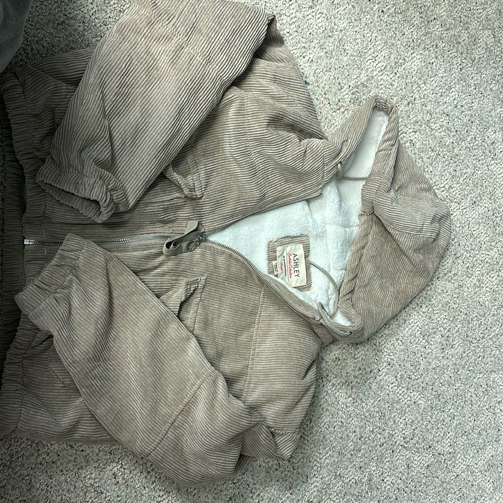Tan winter coat with sherpa fur inside.